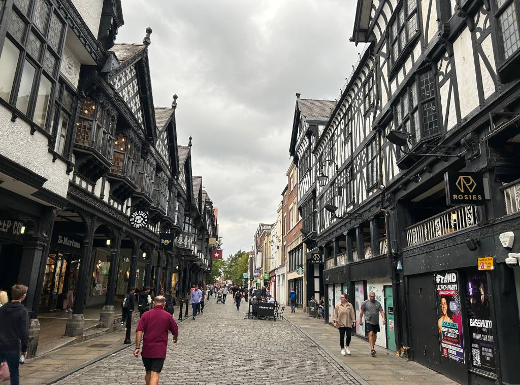 northgate street in chester with buildings with mock-Tudor facades either side of the cobbled street
