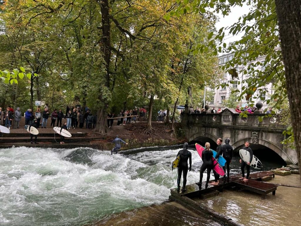 people waiting to surf in the english garden