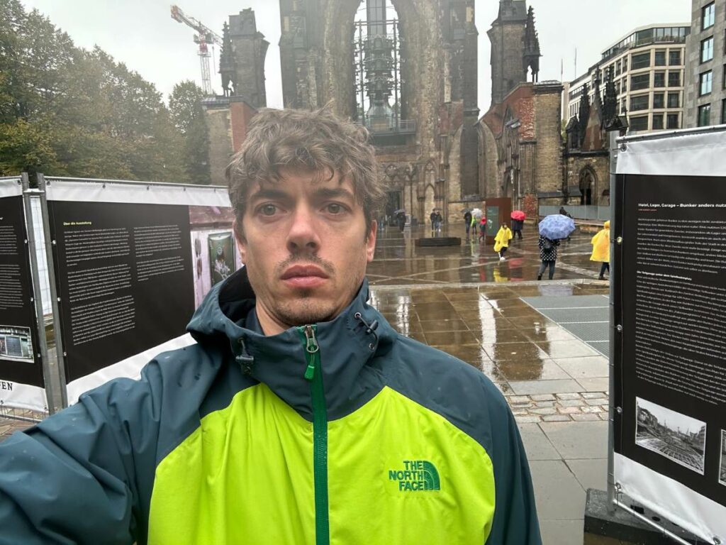 Tom in Hamburg in front of St Nicholas Church