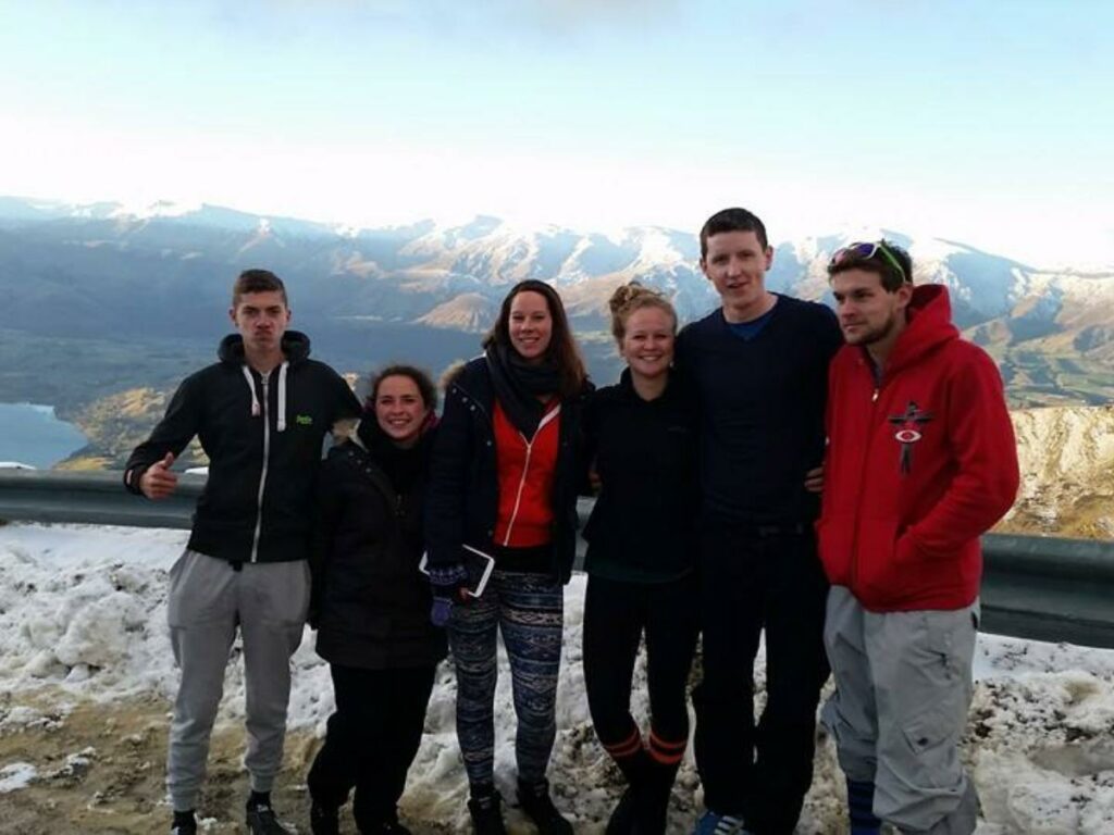 Tom with friends in Queenstown on the skiing range in the mountains