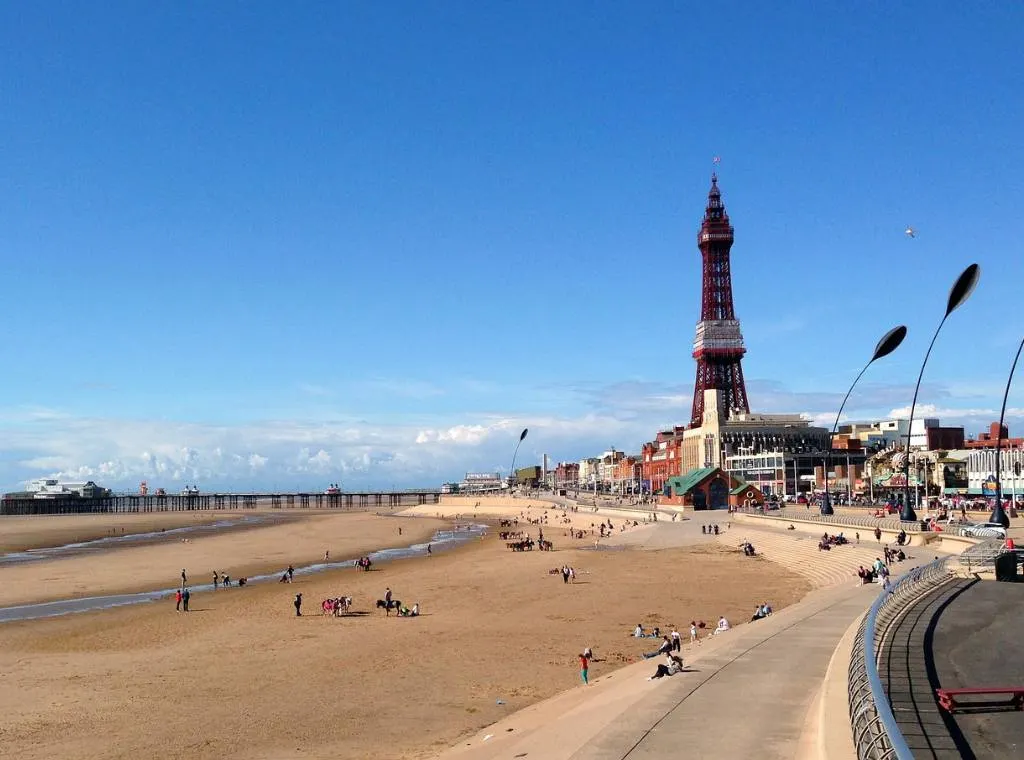 beach in Blackpool on a sunny day, with Blackpool Tower in the background