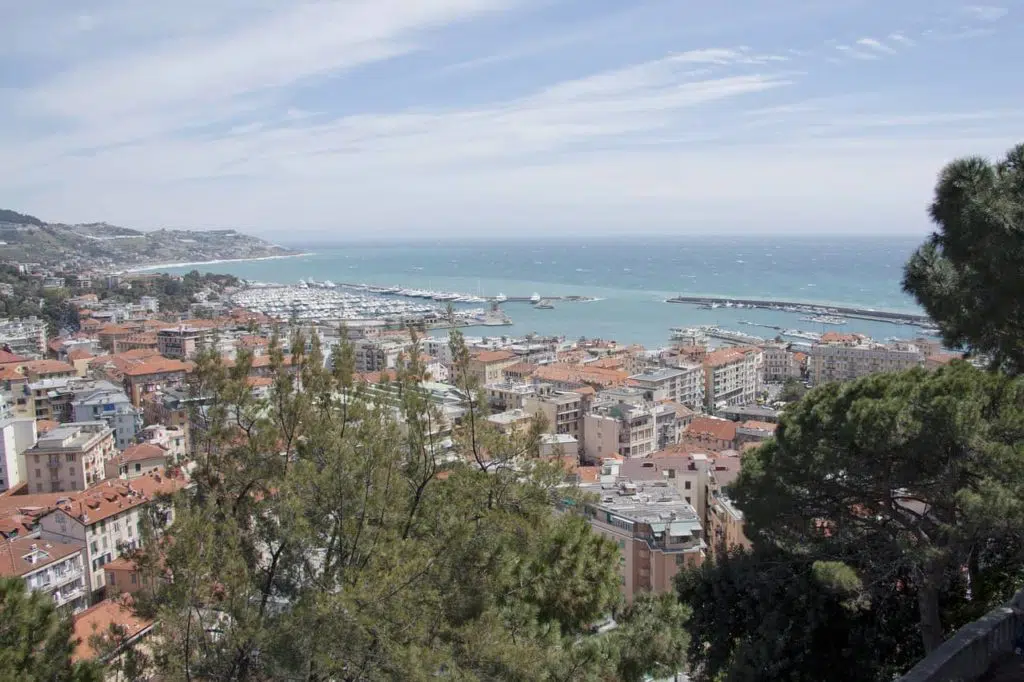 An overhead view of Sanremo from up high with houses and the sea visible