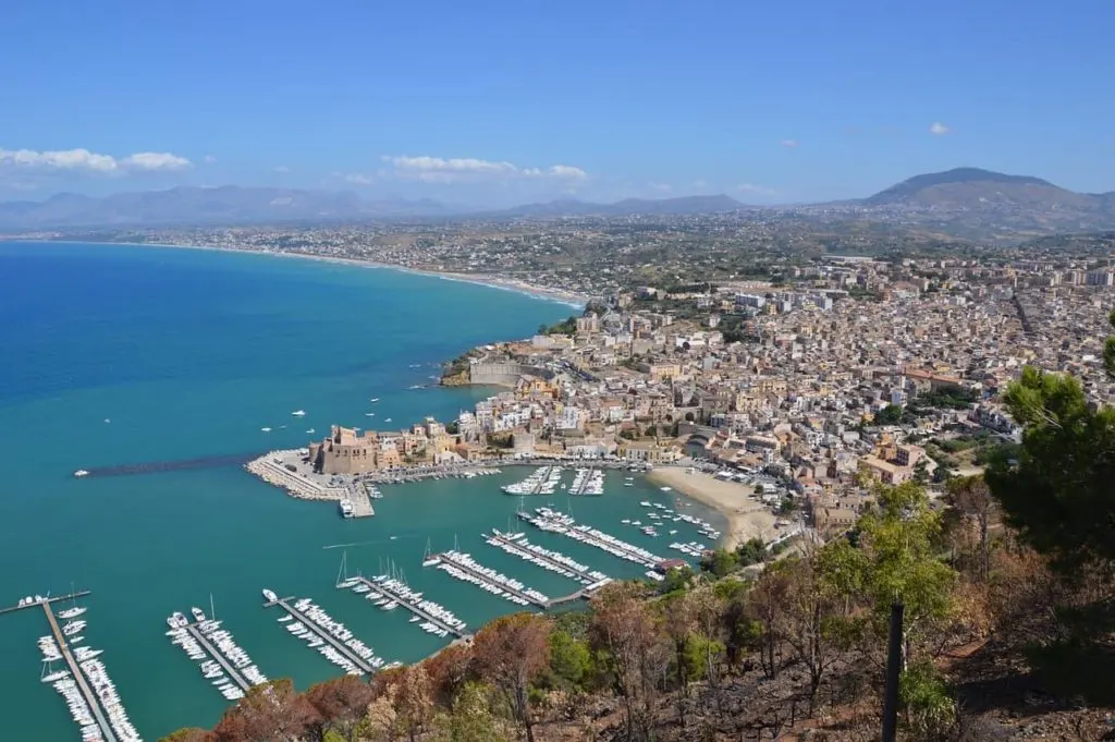 View of Trapani from above with the port visible and the mass of buildings to the right of the picture