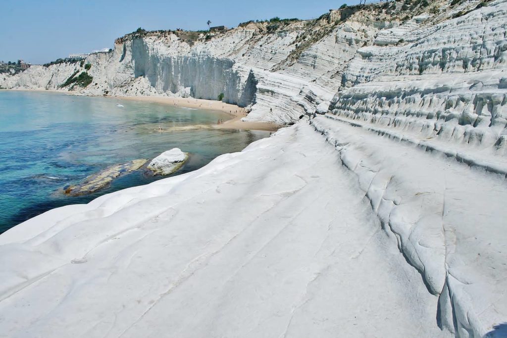 the white shelvs of scala dei turchi curving around the sea