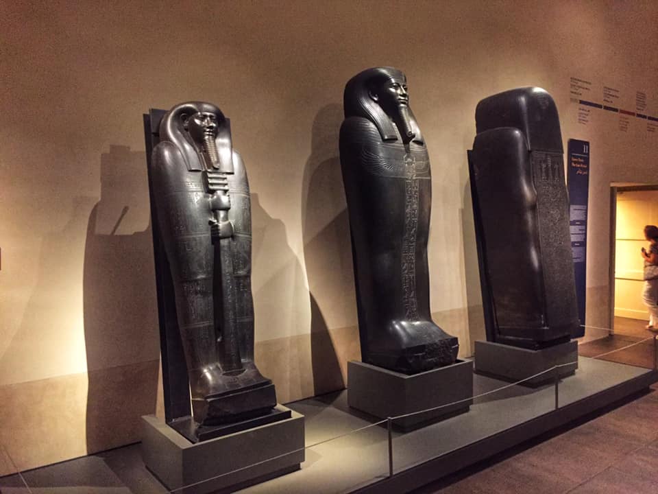 three black sarcophaguses in egyptian museum