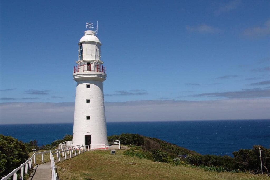 white lighthouse at cape otway with the ocean in the background