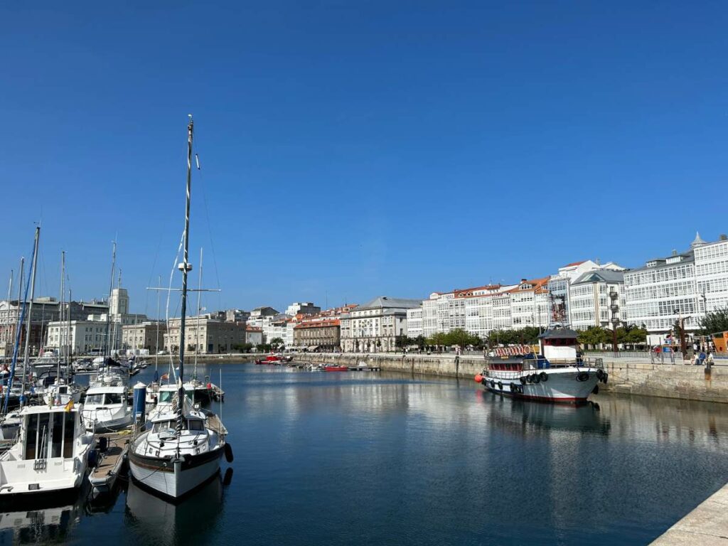Bay in A Coruna with boats docked and buildings to the right of the image