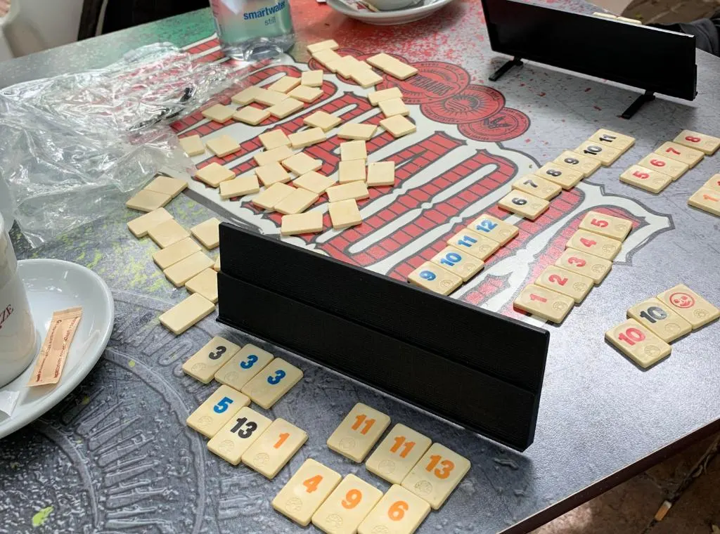 Playing rummikub in Seville with numerous pieces laid out on a table