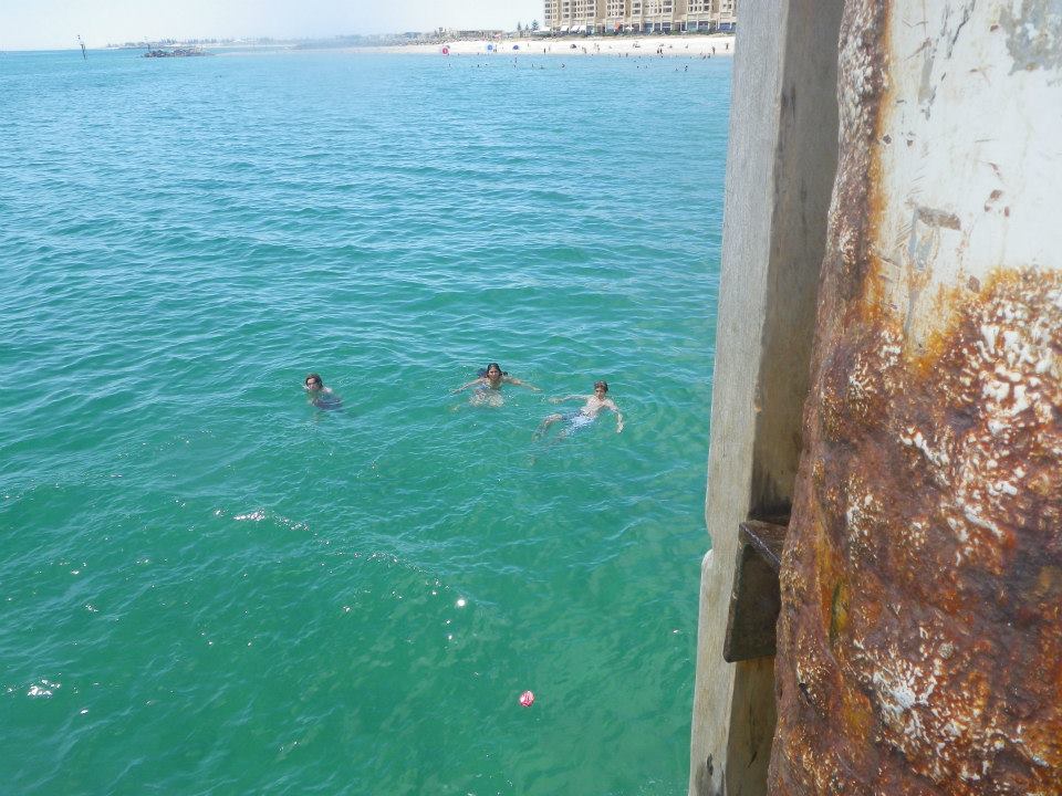 swimming in the sea at glenelg beach