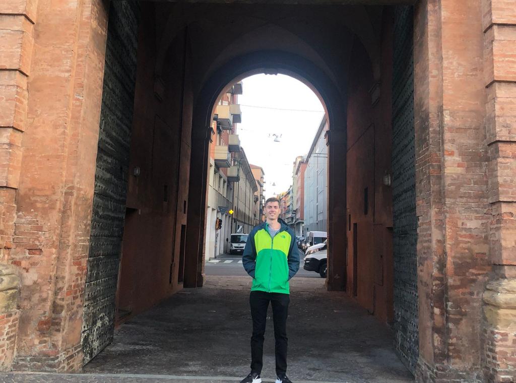 me in front of a gate in Bologna