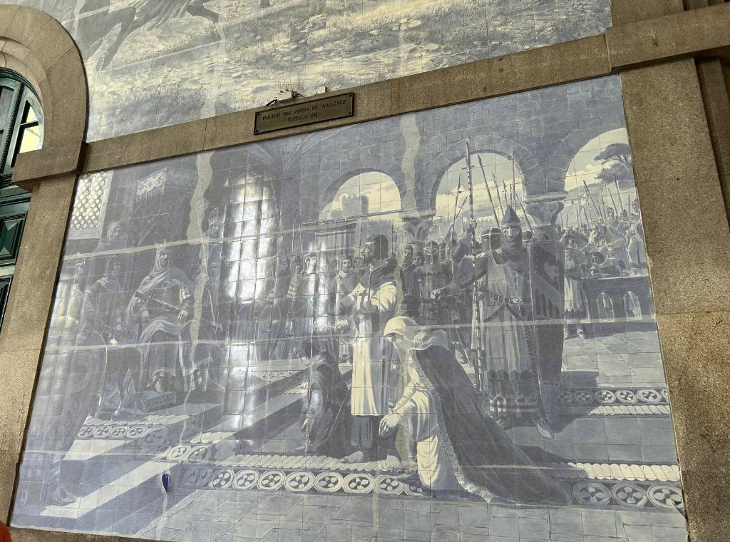 one of the tile murals inside sao bento station in porto