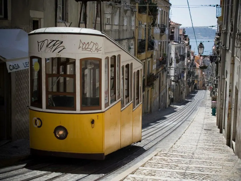 a tram going up a hill in Barrio Alto