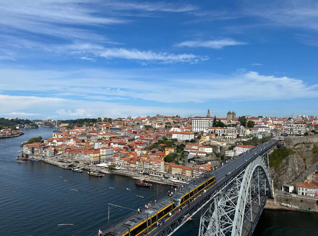 view of porto from up high with the river and bridge visible