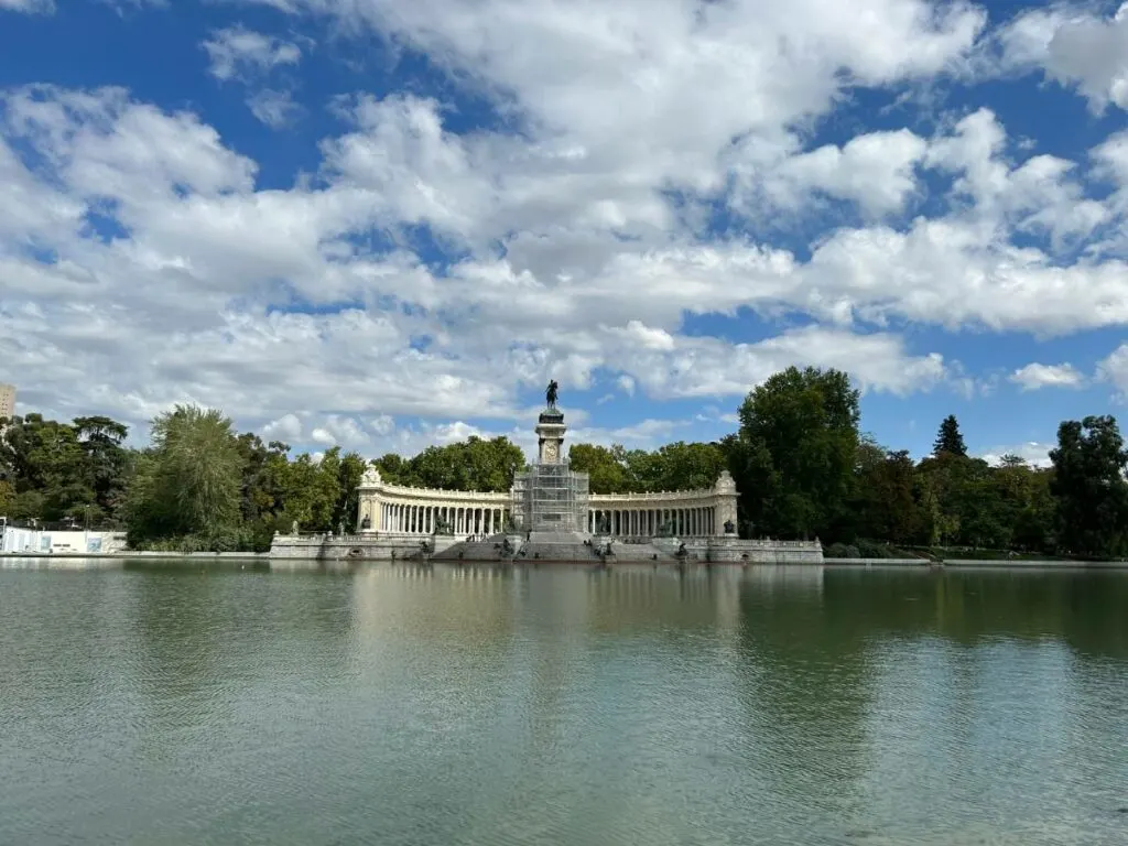 the monument to Alfonso XII in retiro park overlooking the lake