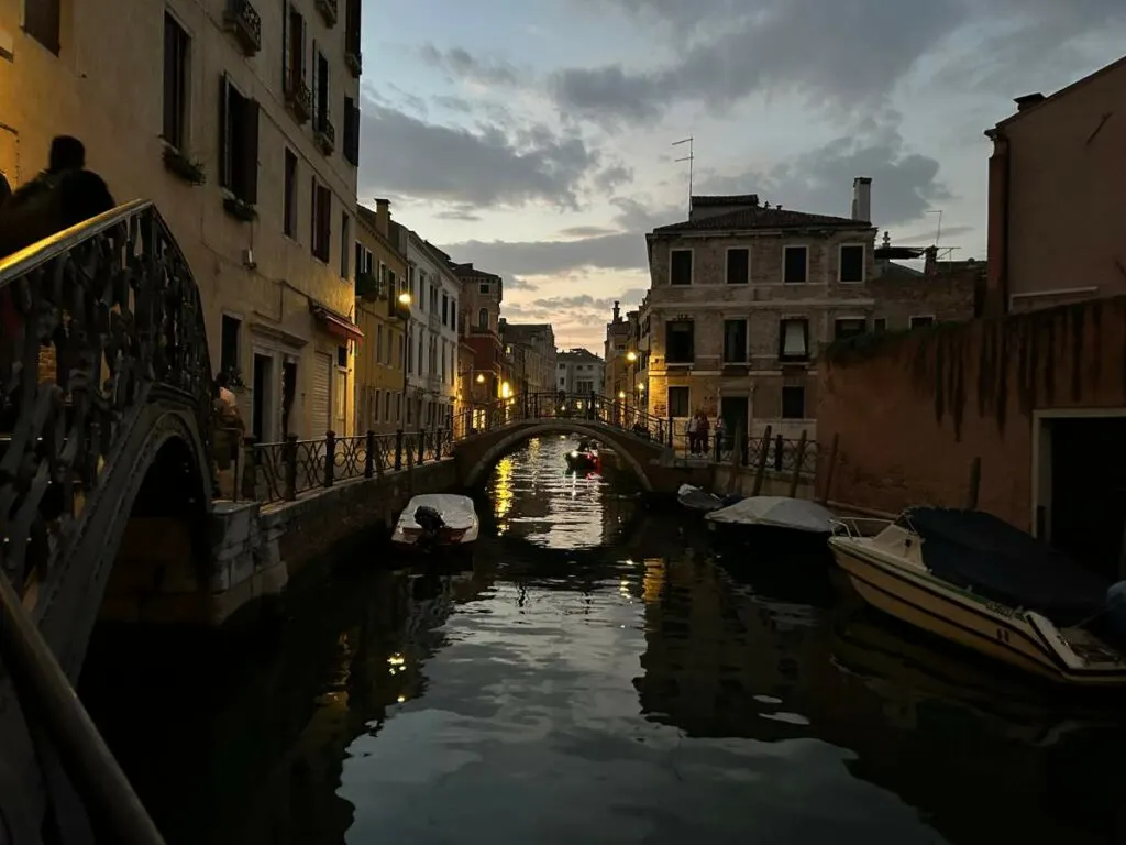 a canal at night in Venice