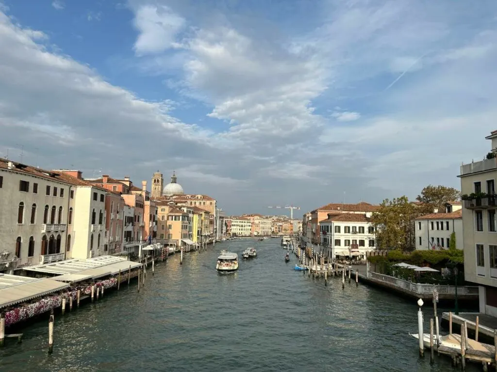 view of canal in Venice with boats on the water