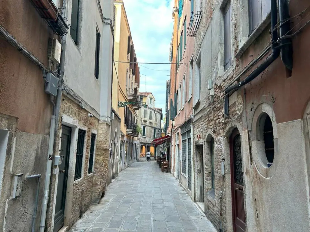 walking through narrow streets in Venice
