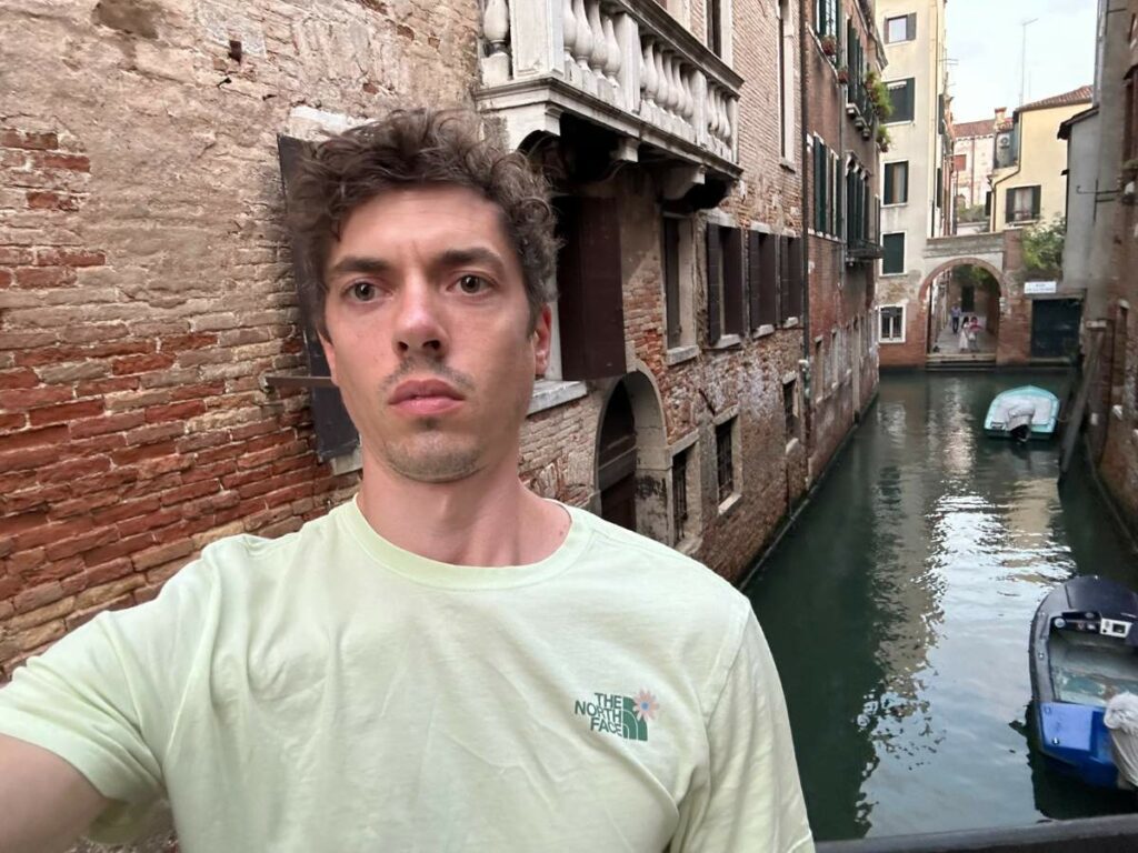 Tom in Venice in front of one of the canals