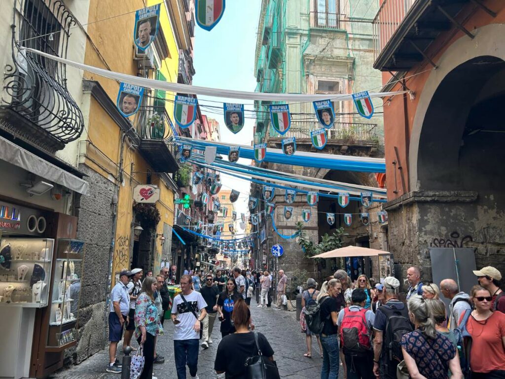 tourists walking in the historic centre of Naples