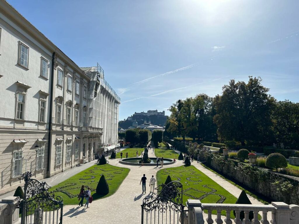 part of the mirabell palace gardens looking to towards festung hohensalzburg