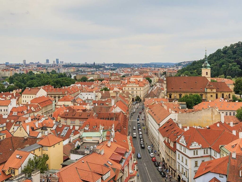 Mala Strana in Prague from St Nicholas Church with orange rooftops visible below